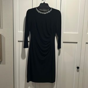 Ralph Lauren 3/4 sleeve black dress size 4. No tags, never worn.